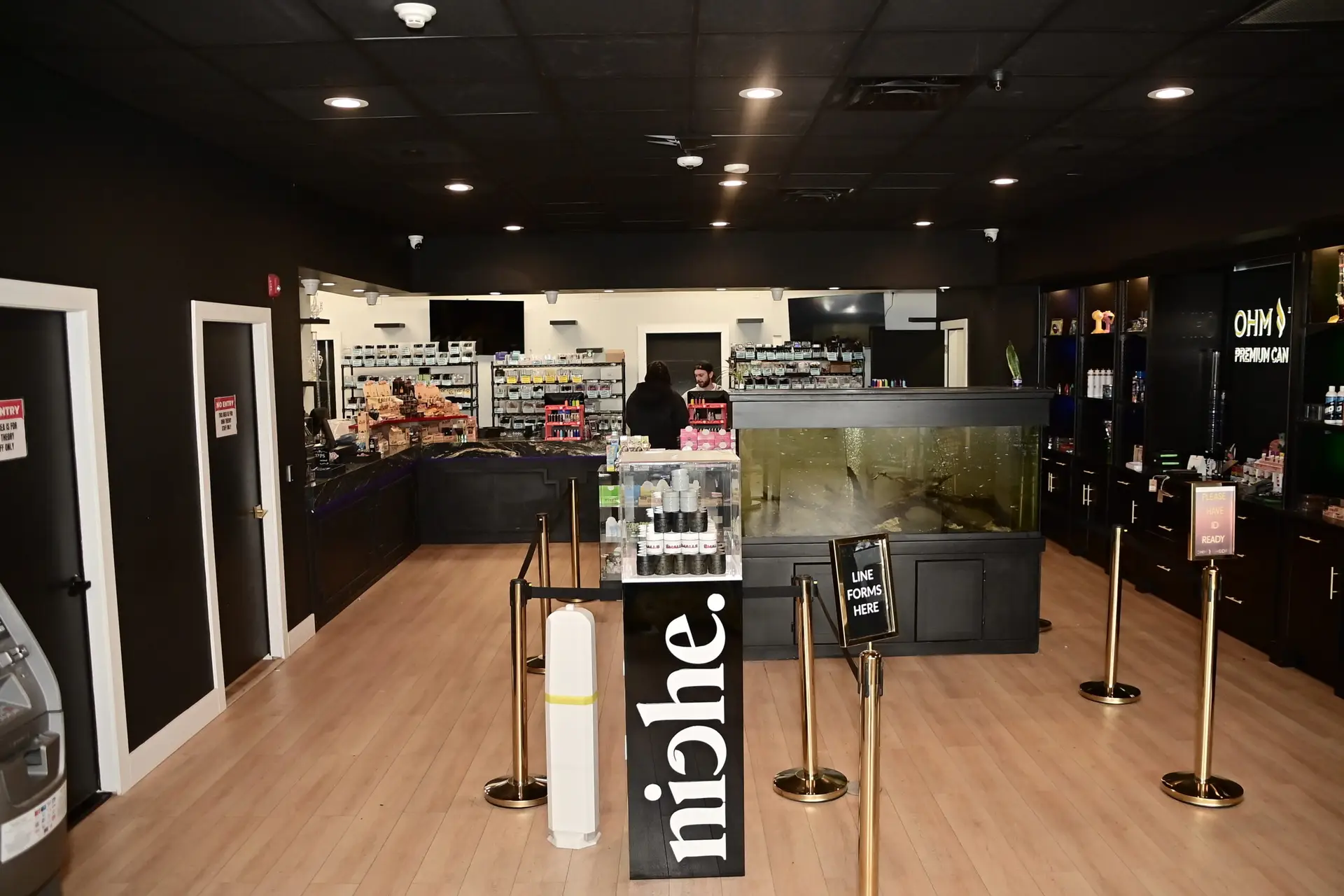 Interior of Ohm Theory cannabis dispensary in Elmwood Park NJ near Paramus and Hackensack showing modern checkout counter, product displays, and premium retail layout