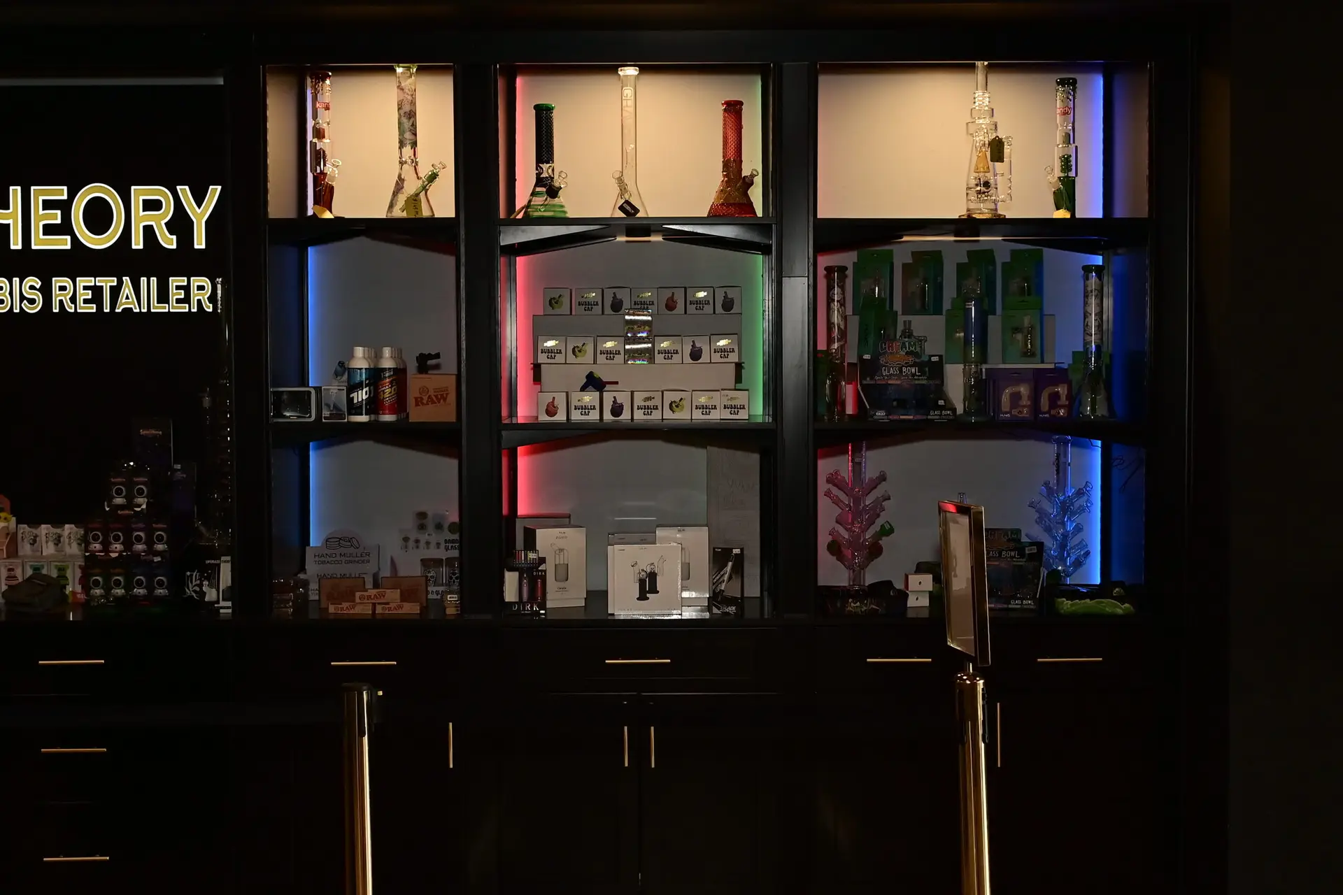 red LED cannabis glass display cabinet at Ohm Theory dispensary in Elmwood Park NJ near Rochelle Park and Lodi