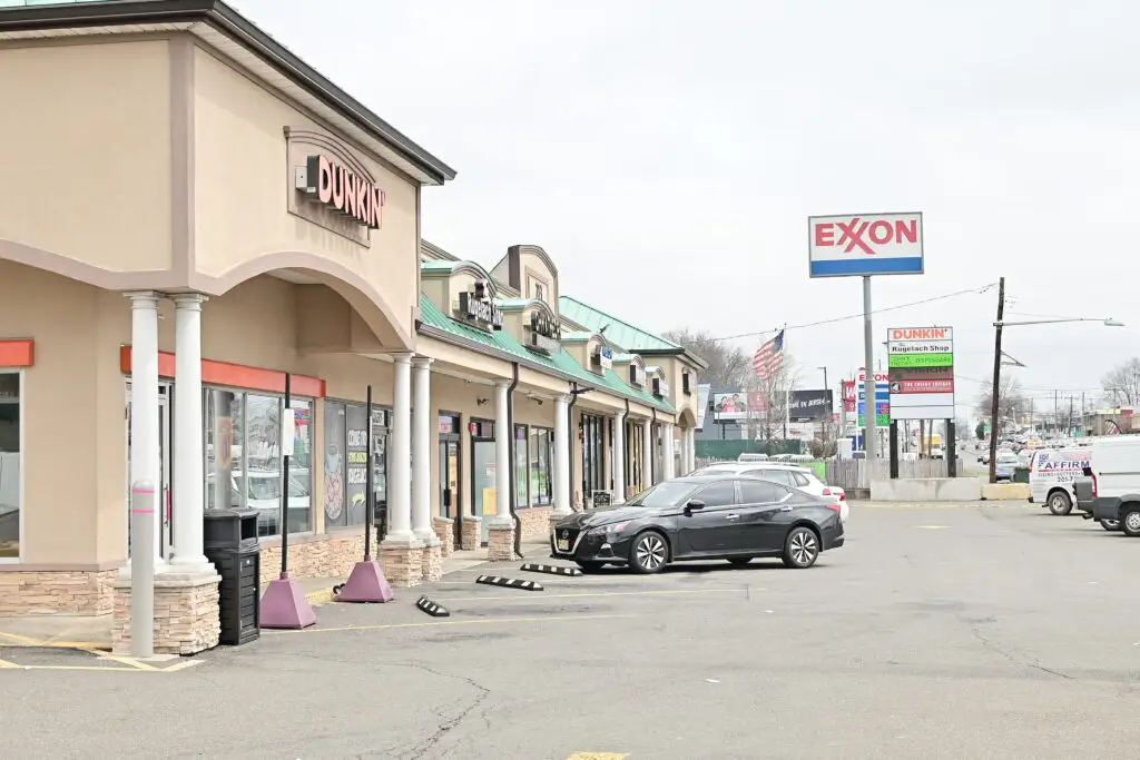 Shopping plaza with Ohm Theory dispensary in Elmwood Park NJ near Route 46 Clifton and Saddle Brook showing parking and nearby businesses how to get to MetLife Stadium